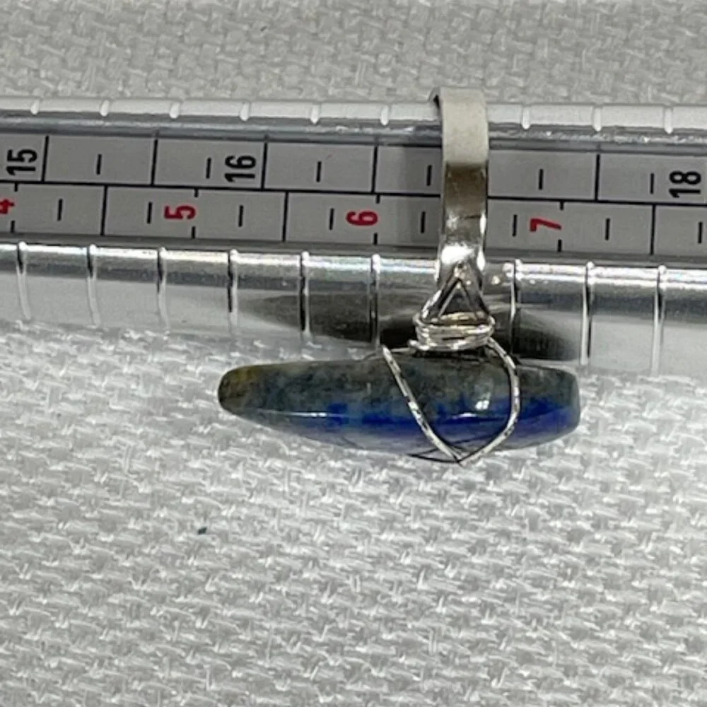 Tear-shaped lapis lazuli and silver adjustable ring.